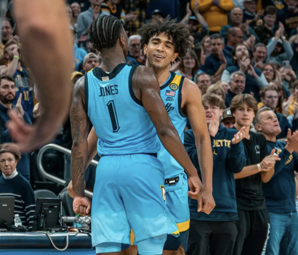 Navigation to Story: Kam Jones’ triple-double helps Marquette hand Purdue its first non-conference loss in nearly four years